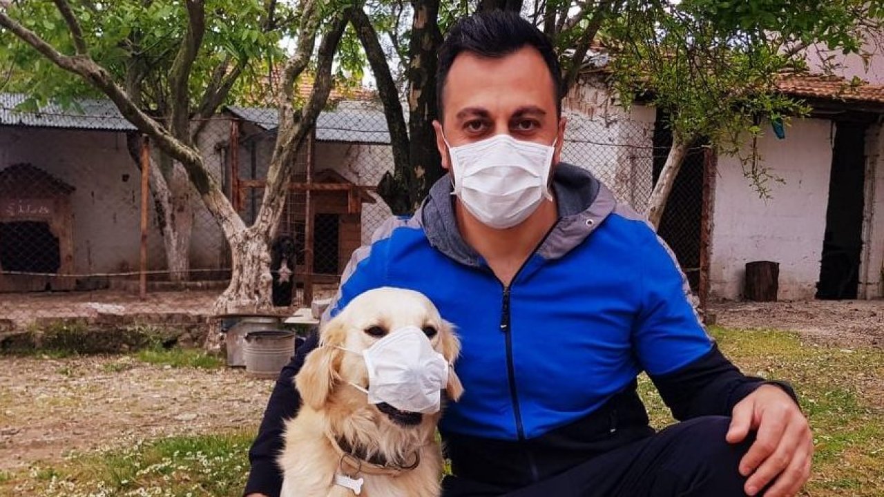 Maske kullanımına dikkat çekmek için köpeğine maske taktı