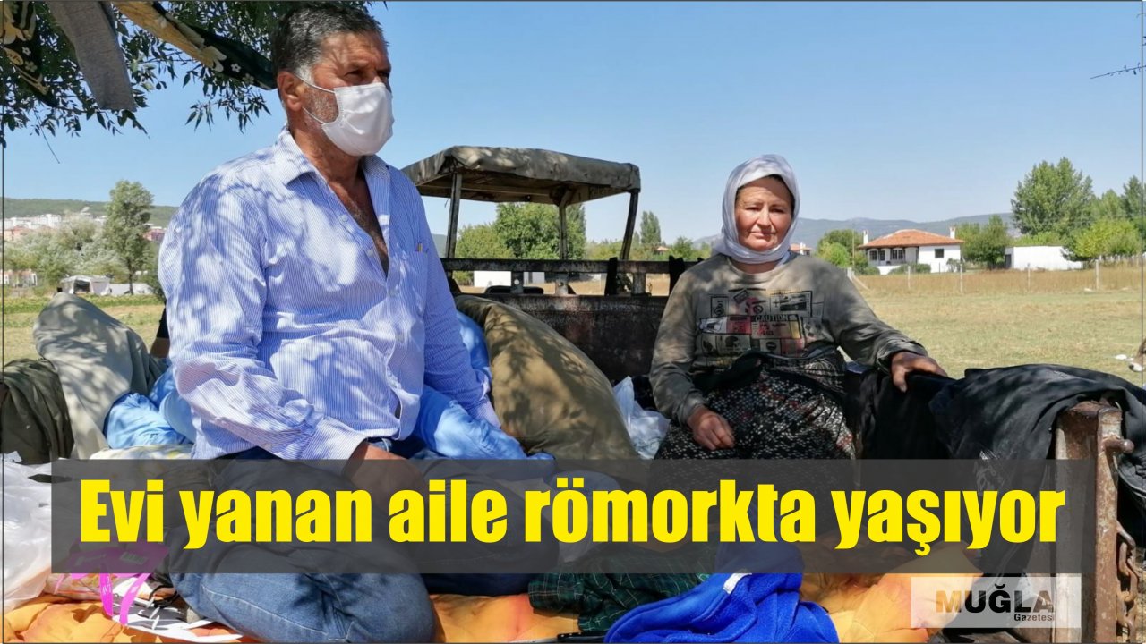 Evi yanan aile römorkta yaşıyor