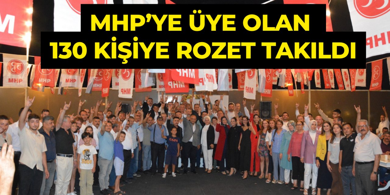MHP’YE ÜYE OLAN 130 KİŞİYE ROZET TAKILDI
